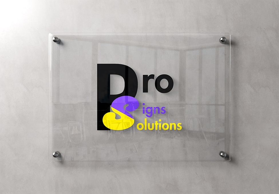 Pro Signs Solutions logo displayed on a clear acrylic wall-mounted sign, featuring a modern and professional design with a black, purple, and yellow color scheme.